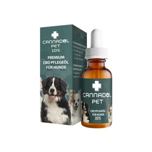 Cannadol Pet 10% CBD Pflegeöl für Hunde mit 1.000 mg CBD, 10-ml-Braunglasflasche mit weißer Pipette neben der grünen Faltschachtel mit Hundemotiv