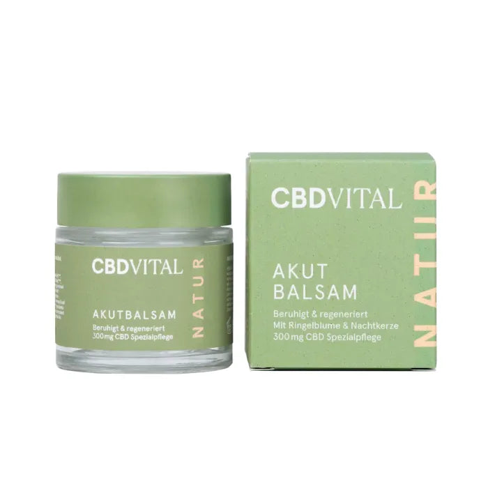 CBD Vital Akutbalsam mit 300 mg CBD, Glastiegel mit grünem Deckel neben der grünen Faltschachtel